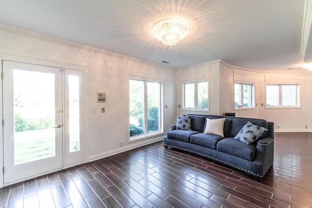 living room featuring ornamental molding, wood tiled floor, and baseboards