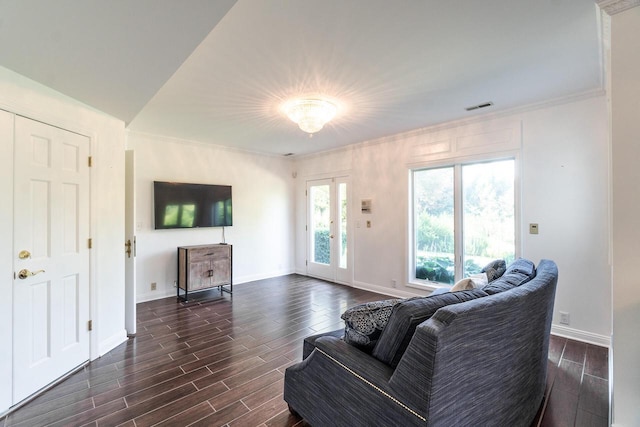 living room with baseboards, ornamental molding, visible vents, and wood tiled floor