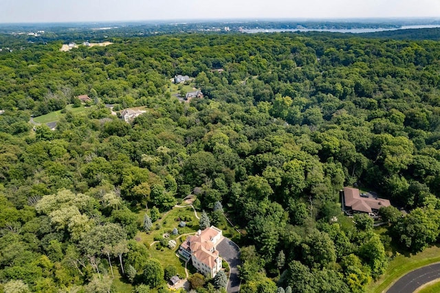 aerial view featuring a wooded view