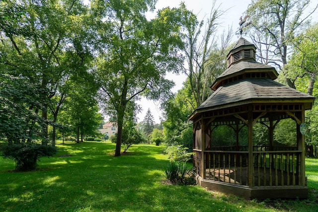 exterior space with a lawn and a gazebo