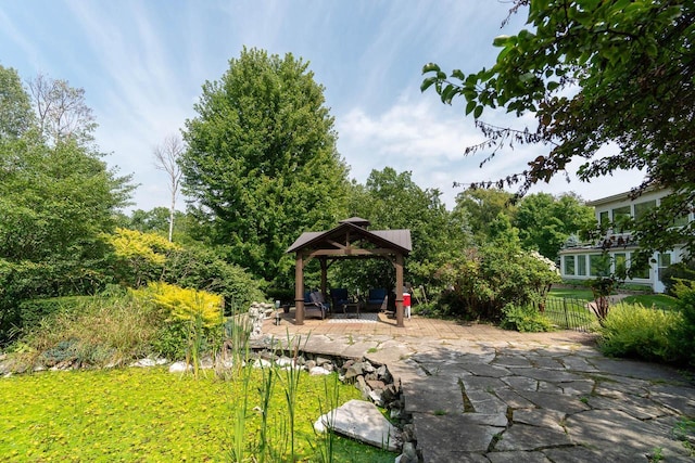 exterior space with a patio, a gazebo, and fence