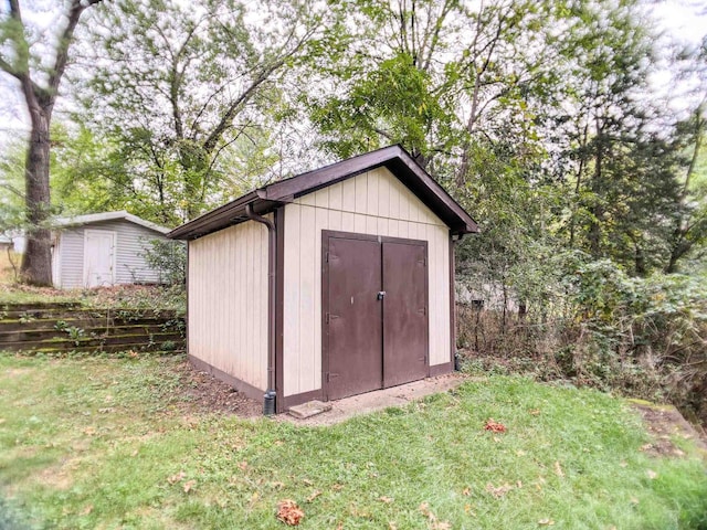 view of outdoor structure featuring a lawn