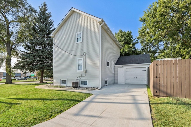 view of home's exterior featuring a garage and a lawn