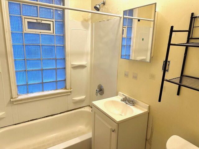 full bathroom featuring vanity, toilet, and shower / bathtub combination