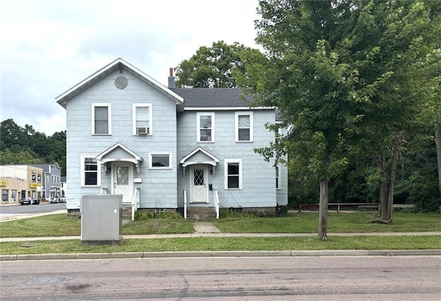 view of front of home featuring a front lawn