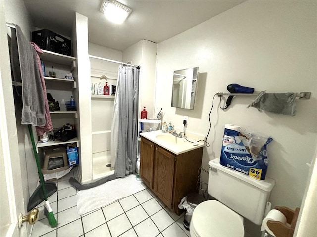 bathroom featuring tile patterned flooring, vanity, a shower with curtain, and toilet