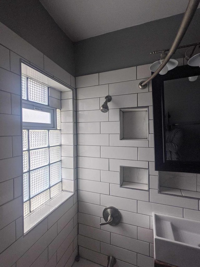 bathroom with a tile shower