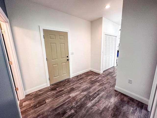 corridor featuring dark hardwood / wood-style floors