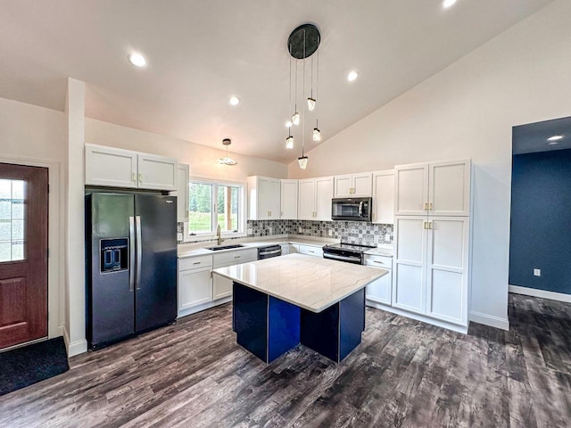 kitchen featuring dark hardwood / wood-style flooring, electric range, a center island, and fridge with ice dispenser