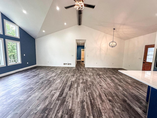 interior space featuring high vaulted ceiling, ceiling fan, dark hardwood / wood-style floors, and beam ceiling