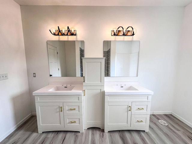 bathroom featuring vanity, hardwood / wood-style floors, and a shower