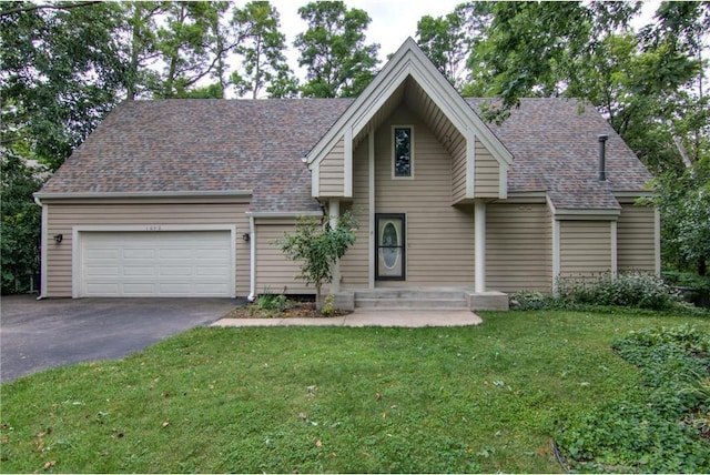 view of front of house featuring a garage and a front yard