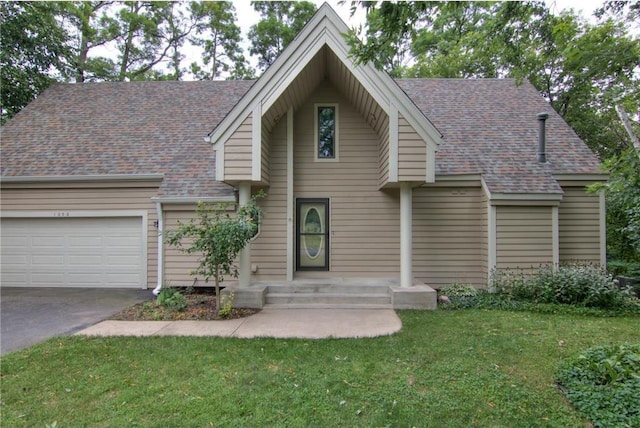 view of front of property featuring a garage and a front lawn