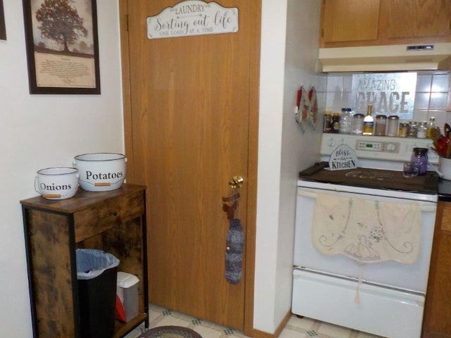 7112 Zielsdorf Dr, Webster, WI 54893 - indoor dry bar featuring under cabinet range hood and white electric range