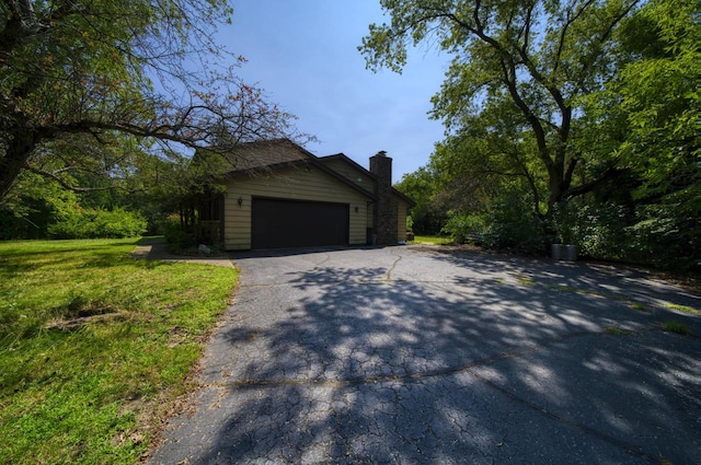 view of side of property featuring a garage