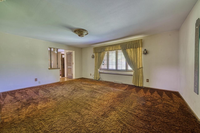 unfurnished room featuring carpet