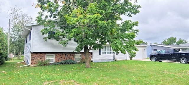 view of front facade with a garage and a front lawn