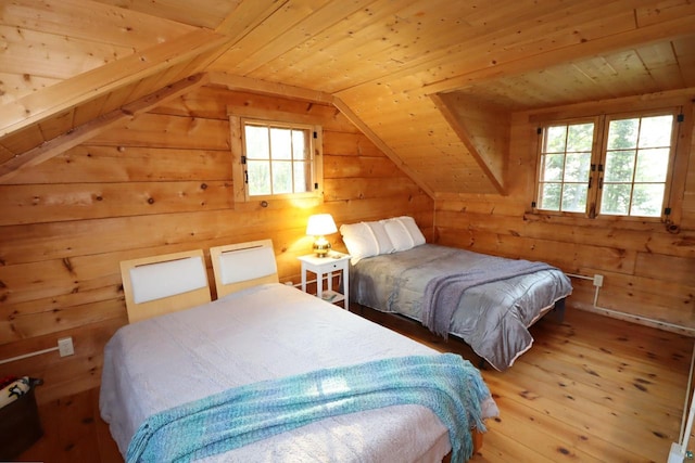 bedroom with wooden ceiling, lofted ceiling, hardwood / wood-style floors, and wood walls