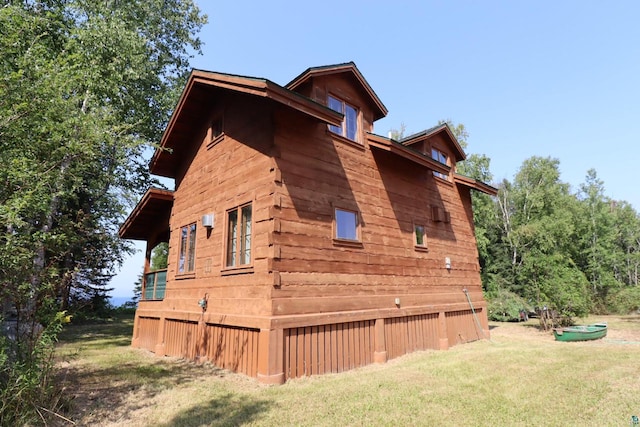 view of home's exterior with a yard