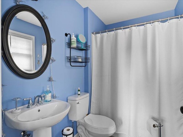 bathroom with toilet and sink