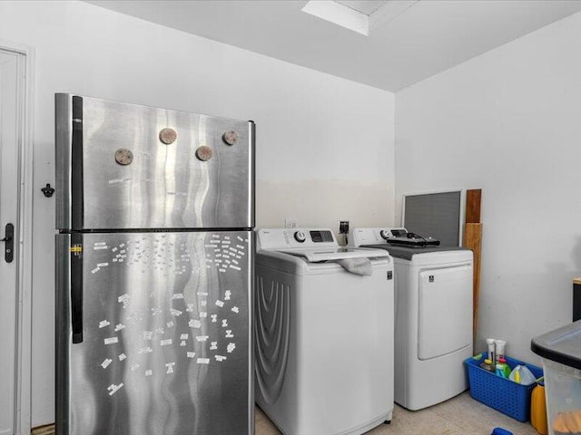 laundry area with washing machine and clothes dryer