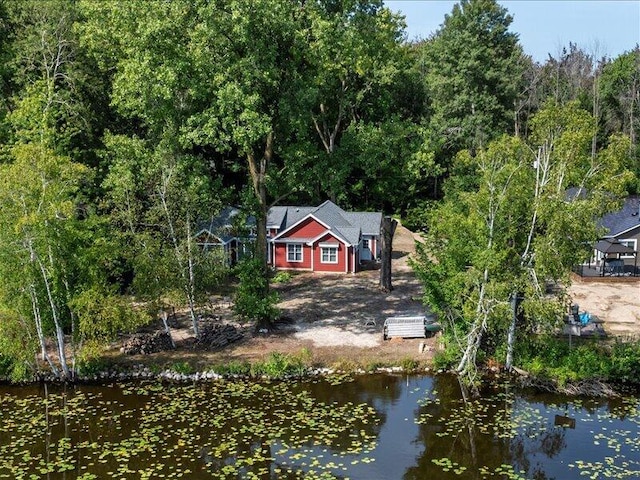 birds eye view of property with a water view