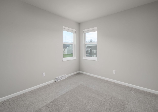 empty room with carpet flooring