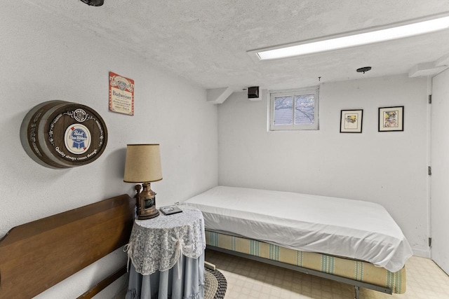 W11585 Demynck Rd, Lodi, WI 53555 - bedroom featuring a textured ceiling and tile patterned floors