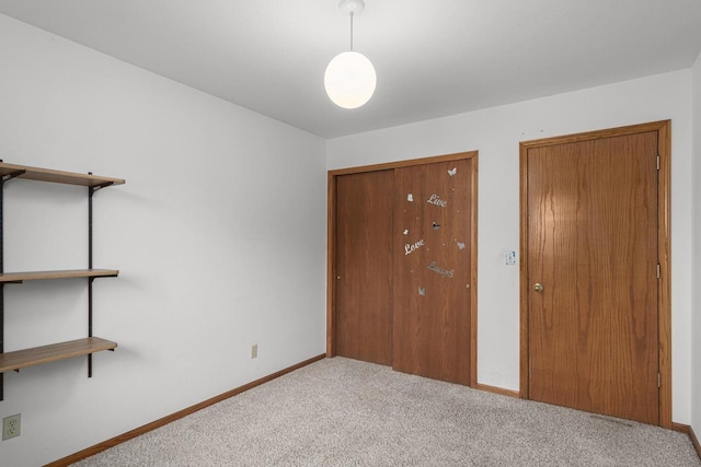 unfurnished bedroom featuring light colored carpet