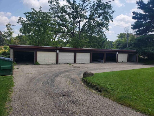 garage with a yard