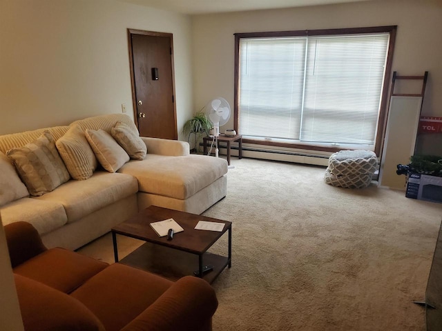 living area featuring a baseboard heating unit and carpet floors