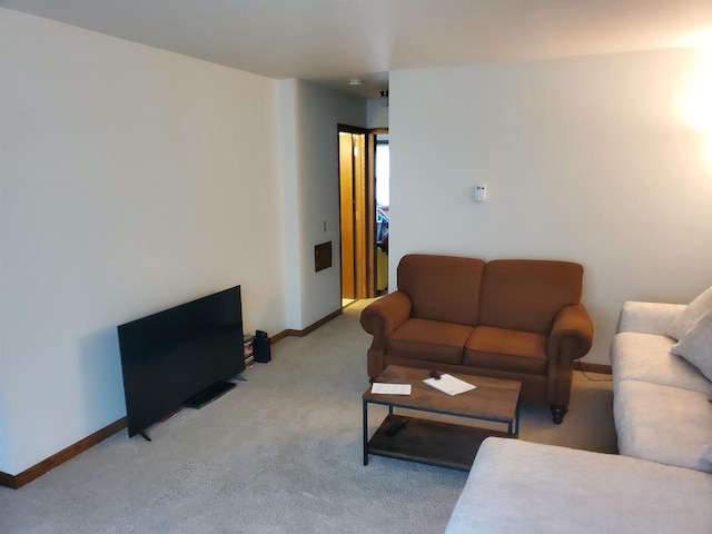 living room with carpet and baseboards