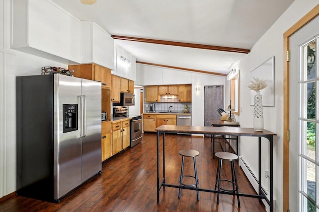 kitchen with dark hardwood / wood-style floors, stainless steel appliances, kitchen peninsula, decorative backsplash, and vaulted ceiling with beams