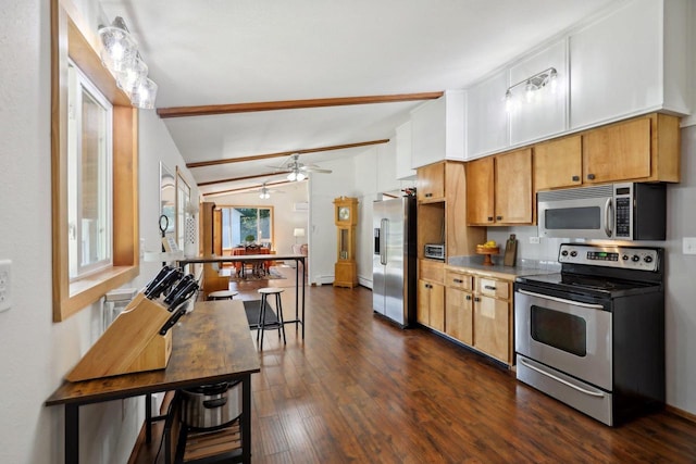 kitchen featuring dark hardwood / wood-style floors, appliances with stainless steel finishes, kitchen peninsula, ceiling fan, and vaulted ceiling with beams