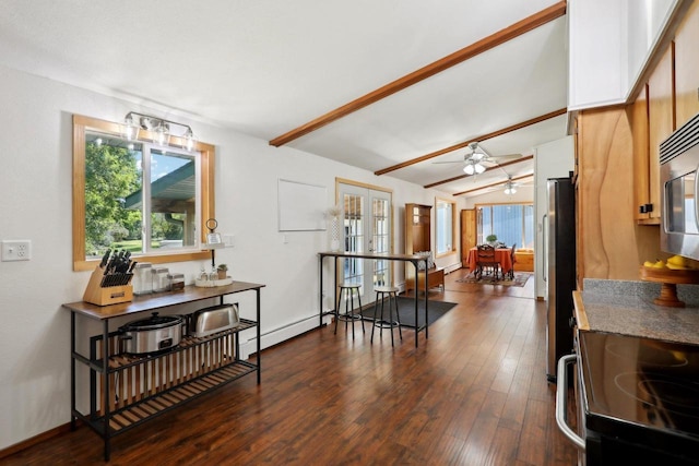 dining room featuring a baseboard heating unit, ceiling fan, dark hardwood / wood-style floors, and lofted ceiling with beams