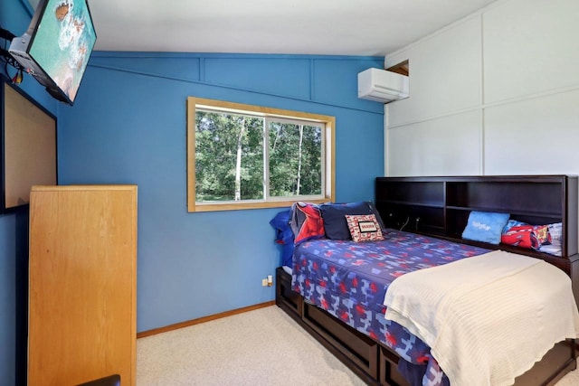 carpeted bedroom with lofted ceiling and a wall mounted air conditioner