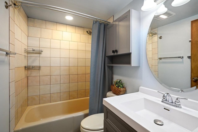 full bathroom with shower / bath combination with curtain, toilet, and vanity