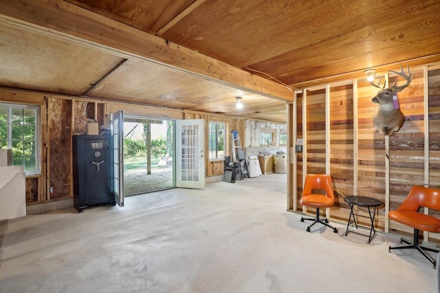 basement with wooden ceiling and french doors