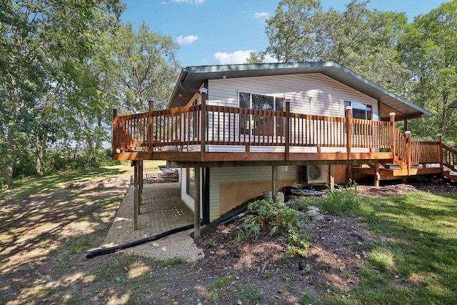 back of property with a wooden deck