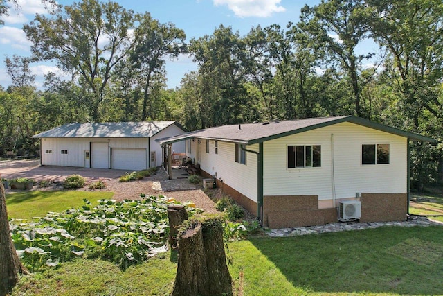 single story home with a front lawn and a garage