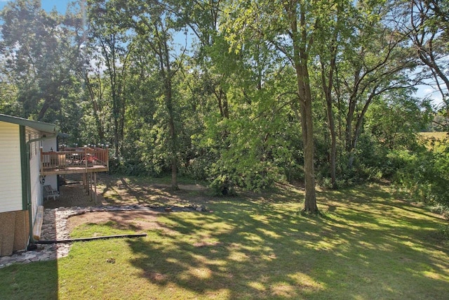 view of yard with a wooden deck