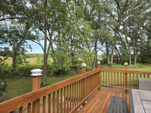 wooden terrace with a yard