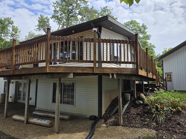 rear view of property with a wooden deck