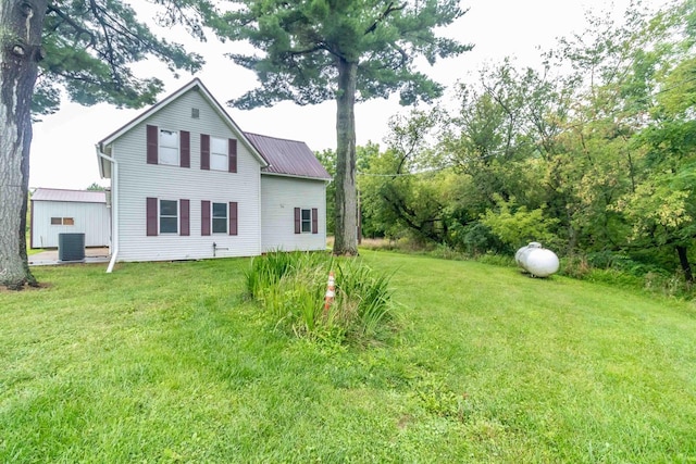 exterior space with a yard and cooling unit