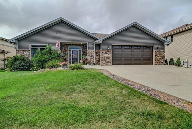 ranch-style home featuring a garage and a front yard