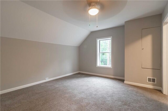 bonus room with vaulted ceiling, carpet floors, and ceiling fan