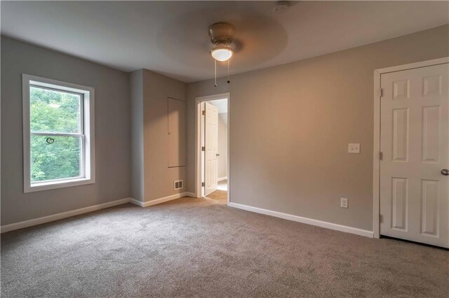 carpeted empty room with ceiling fan