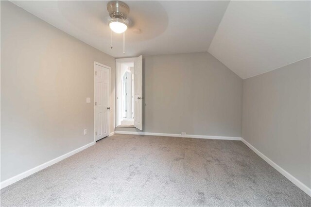 bonus room with lofted ceiling, ceiling fan, and carpet floors