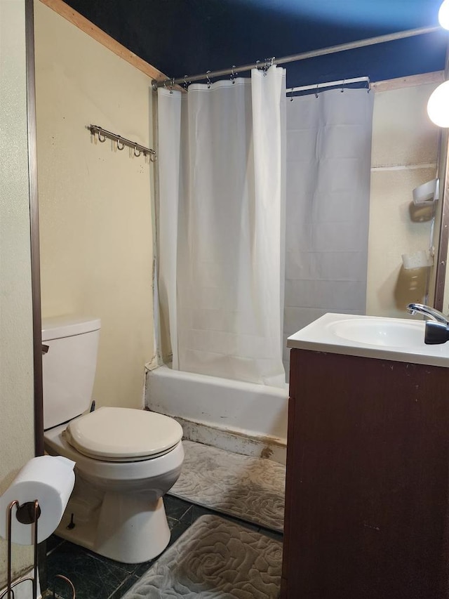 bathroom with toilet, shower / bath combination with curtain, and vanity