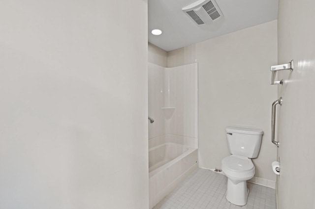 bathroom featuring toilet, tile patterned floors, and bathing tub / shower combination